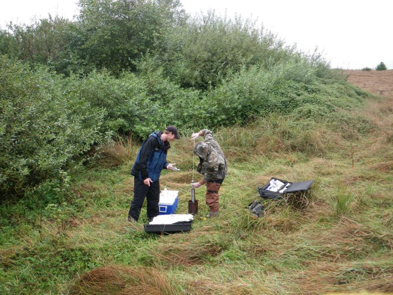People taking water samples